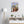 Fine-Art Poster „Blatt 5.1 aus dem „Blauen Skizzenbuch“ von johann franki in einem Arbeitszimmer mit weißgekalkter Wand, Stehlampe und Sideboard – das  Motiv im Hochformat zeigt eine Gruppe Wesen.Fine-Art Poster „Blatt 6.2“ aus dem „Blauen Skizzenbuch“ von johann franki in einem Ruheraum mit weißgekalkter Wand und Bett – das  Motiv zeigt eine Figur auf einem schwebendem Board.