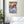 Fine-Art Poster „Blatt 9b“ aus dem „Blauen Skizzenbuch“ von johann franki in einem Ruheraum mit weißgekalkter Wand und Bett – das  Motiv zeigt eine abstrakte Szenerie in die Figuren und Architektur hineinprojeziert werden kann.